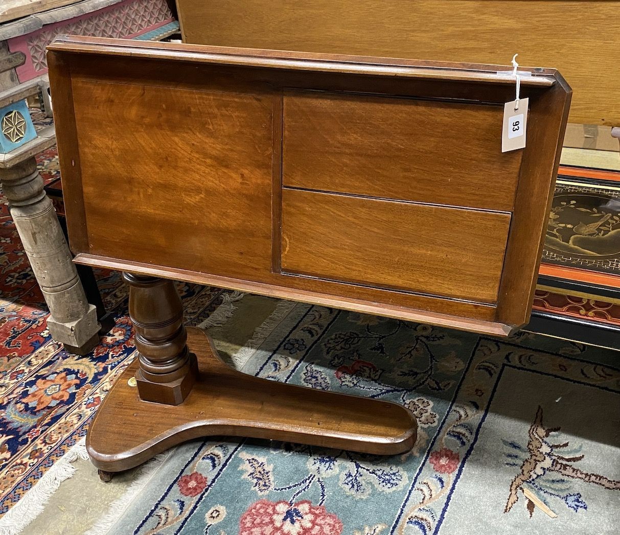 A mahogany Alfred Carter Patent adjustable reading table, width 80cm